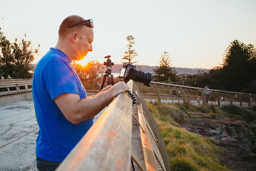 a photography student at sunset learning on a camera class in sydney