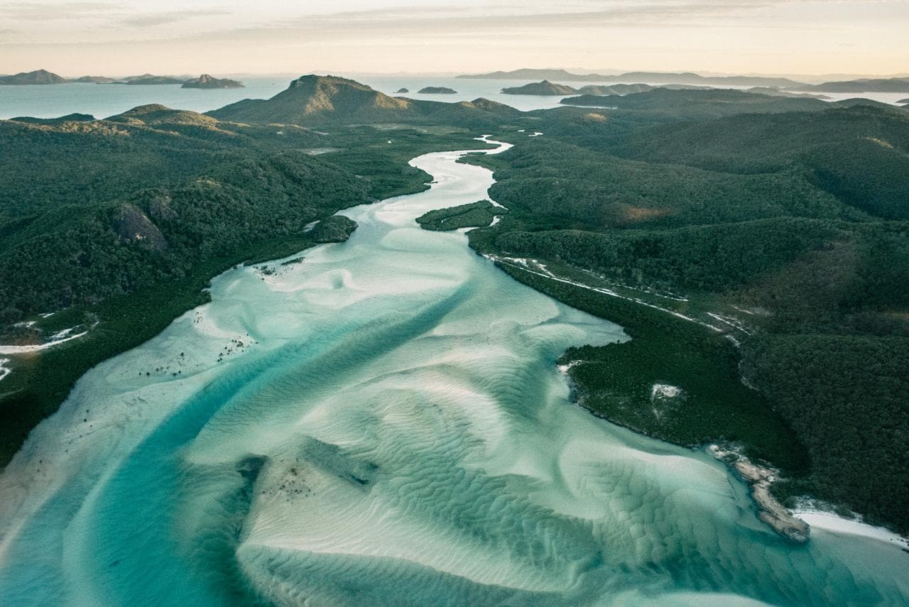 Aerial photograph of Whitsunday Islands by Daniel Bilsborough