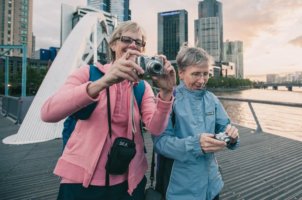 Students comparing cameras during photography course Melbourne
